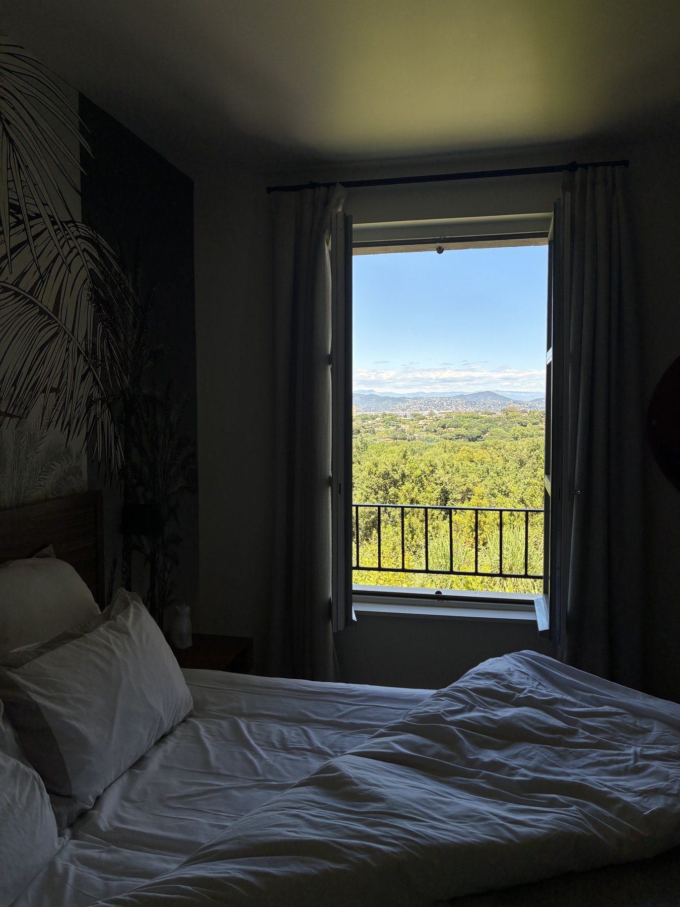 The bedroom, window open